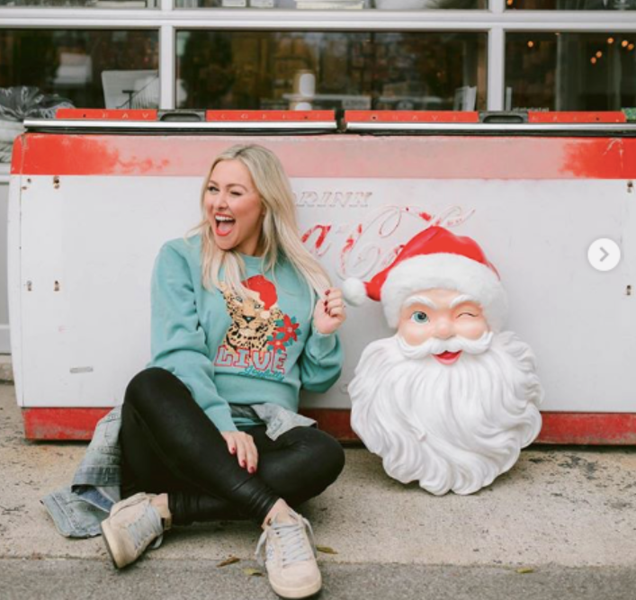 A picture of Mallory Ervin from instragram with a Santa face