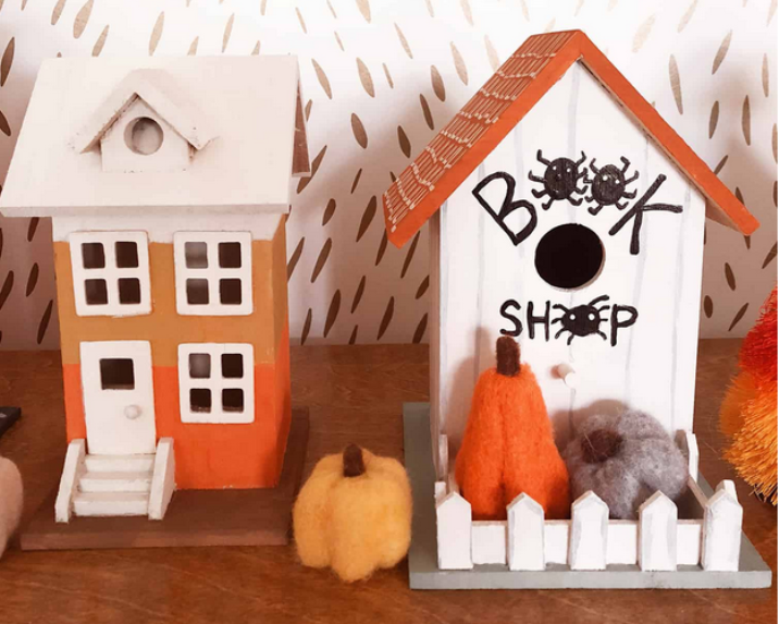 An image of two miniature houses in halloween theme.
